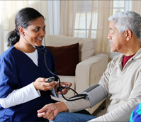 nurse and girl with blood pressure cuff